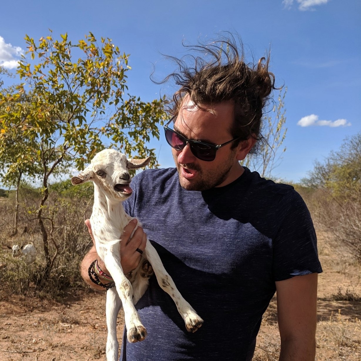 Chris Janssen, Canadian comedian based in rural Jutland Denmark, holding a goat